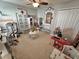 Bright playroom with multiple play stations, including a hospital, bakery, and dress-up area, fostering creativity at 295 Whirlaway Drive, Davenport, FL 33837