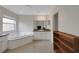 Light-filled bathroom featuring a garden tub and a vanity with wooden shelving in a well-lit space at 32942 Rambling Oaks Ct, Leesburg, FL 34748