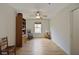 Simple bedroom features laminate wood flooring, ceiling fan, and a window at 32942 Rambling Oaks Ct, Leesburg, FL 34748