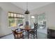 Dining area with table and chairs, natural light, and a sliding glass door at 32942 Rambling Oaks Ct, Leesburg, FL 34748
