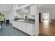 Kitchen sink and countertop with a view of adjacent dining area at 32942 Rambling Oaks Ct, Leesburg, FL 34748