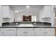 Kitchen sink and countertop area overlooking living space at 32942 Rambling Oaks Ct, Leesburg, FL 34748
