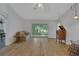 Living room featuring a sliding glass door and wood floors at 32942 Rambling Oaks Ct, Leesburg, FL 34748