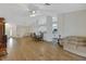 Bright living room with a sliding glass door to the porch at 32942 Rambling Oaks Ct, Leesburg, FL 34748