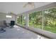Screened patio with ceiling fan and views of the beautiful backyard landscaping at 32942 Rambling Oaks Ct, Leesburg, FL 34748