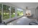 Relaxing screened patio with ceiling fan and views of the lush, green backyard at 32942 Rambling Oaks Ct, Leesburg, FL 34748