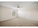 Bright bedroom with neutral carpeting, a ceiling fan, and a view from the window at 3393 Woodridge Dr, The Villages, FL 32162
