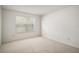 Neutral bedroom with carpet, a window with blinds, and ample natural light at 3393 Woodridge Dr, The Villages, FL 32162