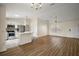 Bright, open-concept layout featuring wood floors and modern stainless steel appliances at 3393 Woodridge Dr, The Villages, FL 32162