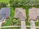 Aerial view of a property showcasing the house, landscaping, and surrounding neighborhood at 3507 Arlington Ridge Blvd, Leesburg, FL 34748