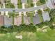 Aerial view of homes in a neighborhood with manicured lawns and tree-lined streets at 3507 Arlington Ridge Blvd, Leesburg, FL 34748