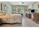 Spacious bedroom with light gray floors, large window, and ample natural light at 3507 Arlington Ridge Blvd, Leesburg, FL 34748