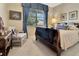 Comfortable bedroom with a sleigh bed, soft lighting, and a serene window view at 3507 Arlington Ridge Blvd, Leesburg, FL 34748