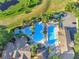 Aerial view of luxurious community pools with beautiful landscaping and a relaxing atmosphere at 3507 Arlington Ridge Blvd, Leesburg, FL 34748