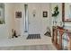 Bright and airy foyer featuring tile flooring, white door and stylish decor at 3507 Arlington Ridge Blvd, Leesburg, FL 34748