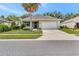 Charming single-story home with well-maintained lawn, mature landscaping, and a two-car garage at 3507 Arlington Ridge Blvd, Leesburg, FL 34748