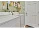 Practical laundry room with washer, dryer, storage shelves, and a convenient layout at 3507 Arlington Ridge Blvd, Leesburg, FL 34748