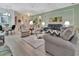 Bright living room with neutral colors, stylish furniture, and plenty of natural light at 3507 Arlington Ridge Blvd, Leesburg, FL 34748