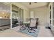 Screened patio area features a ceiling fan and a dining table with four chairs at 3507 Arlington Ridge Blvd, Leesburg, FL 34748