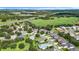 Wide aerial shot of homes near conservation areas and major thoroughfares, blending convenience at 3601 Mount Hope Loop, Leesburg, FL 34748