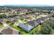 Beautiful aerial view of the neighborhood showcasing well-kept lawns and mature trees at 3601 Mount Hope Loop, Leesburg, FL 34748