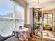 Bright breakfast nook with a sliding glass door, cozy seating, and backyard views at 3601 Mount Hope Loop, Leesburg, FL 34748