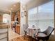 Charming breakfast nook with a view, complemented by cozy seating and natural light at 3601 Mount Hope Loop, Leesburg, FL 34748
