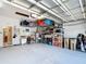 Spacious garage with overhead racks, storage shelves, and a clean, well-maintained floor at 3601 Mount Hope Loop, Leesburg, FL 34748