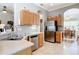 Well-lit kitchen features stainless steel appliances and ample counter space at 3601 Mount Hope Loop, Leesburg, FL 34748