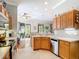Open kitchen with stainless steel appliances and sliding door access to the patio at 3601 Mount Hope Loop, Leesburg, FL 34748