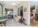 Relaxing lanai with tiled flooring, ceiling fan, and furniture at 3601 Mount Hope Loop, Leesburg, FL 34748