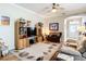 Comfortable living room with decorative accents and a ceiling fan at 3601 Mount Hope Loop, Leesburg, FL 34748