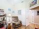 Comfortable living room features hardwood flooring, neutral paint, and ample natural light at 3601 Mount Hope Loop, Leesburg, FL 34748