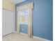 Bedroom featuring a window, closet, and neutral-toned walls at 3677 Serena Ln, Clermont, FL 34711