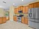 Eat-in kitchen with stainless steel appliances and ample cabinet space at 3677 Serena Ln, Clermont, FL 34711