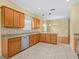 Spacious kitchen featuring granite countertops and tile flooring at 3677 Serena Ln, Clermont, FL 34711