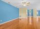 Bright living room with hardwood floors and a ceiling fan at 3677 Serena Ln, Clermont, FL 34711