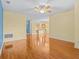 Open-concept living area with sleek flooring that flows seamlessly into the inviting kitchen and dining spaces at 3677 Serena Ln, Clermont, FL 34711
