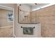 Modern bathroom featuring a glass enclosed shower with tiled walls at 3681 Arlington Ridge Blvd, Leesburg, FL 34748