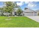 Charming single Gathering home features a well-manicured lawn and mature landscaping at 3681 Arlington Ridge Blvd, Leesburg, FL 34748