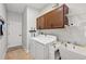 Laundry room with washer, dryer, utility sink, cabinets, and shelves at 3681 Arlington Ridge Blvd, Leesburg, FL 34748