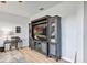 Living area with a large entertainment center, a desk, and views of the home's stylish decor at 3681 Arlington Ridge Blvd, Leesburg, FL 34748
