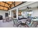 Covered patio with seating area, ceiling fan, and outdoor kitchen at 3681 Arlington Ridge Blvd, Leesburg, FL 34748