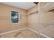 Walk-in closet with shelving for storage and a window to let in the light at 3681 Arlington Ridge Blvd, Leesburg, FL 34748
