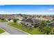 Aerial view of a home in a desirable community featuring mature landscaping and an enclosed lanai at 3750 Raspberry Ct, The Villages, FL 32163