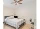 Bedroom with vaulted ceilings and great light, featuring a comfortable bed and a dedicated workspace at 3750 Raspberry Ct, The Villages, FL 32163