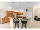 Beautiful kitchen with granite countertops, stainless steel appliances, and breakfast bar at 3750 Raspberry Ct, The Villages, FL 32163