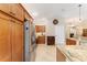 Bright kitchen featuring stainless steel appliances, granite countertops, and an abundance of storage at 3750 Raspberry Ct, The Villages, FL 32163