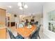 Open-concept living space with combined kitchen, dining, and living areas, perfect for entertaining and Gathering time at 3750 Raspberry Ct, The Villages, FL 32163