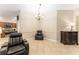 Cozy sitting area with natural light, a comfortable chair, and classic furnishings at 3750 Raspberry Ct, The Villages, FL 32163